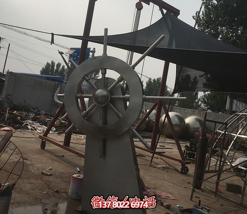 腾飞不锈钢雕塑船舵，点缀室内饭店