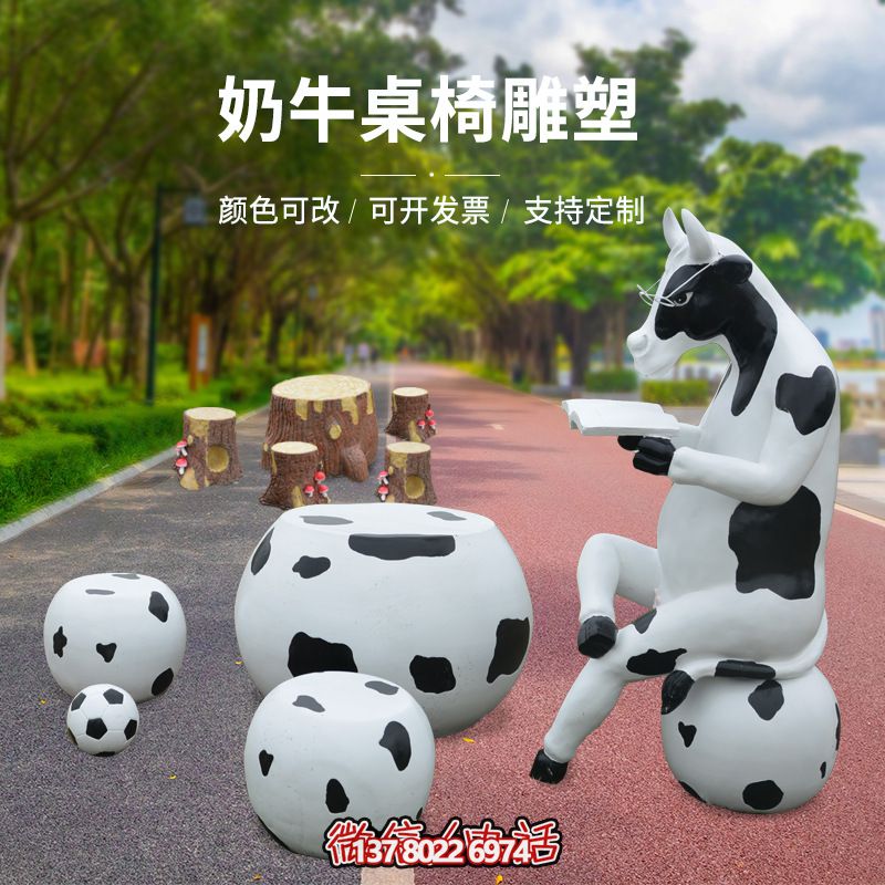 玻璃钢雕塑牛只着看书桌椅，林中户外休闲体验