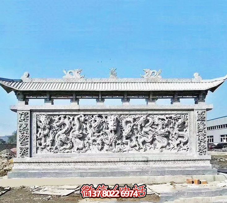 企业门口处摆放大理石九龙壁雕塑