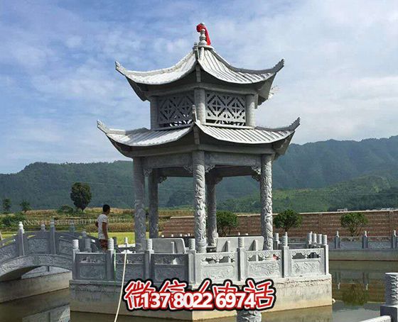 景区湖中摆放双层青石仿古观景休闲凉亭